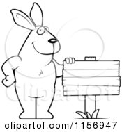 Cartoon Clipart Of A Black And White Big Rabbit By A Wooden Sign Vector Outlined Coloring Page