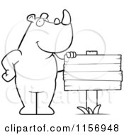 Cartoon Clipart Of A Black And White Rhino By A Sign Vector Outlined Coloring Page