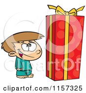 Boy Standing By A Large Christmas Gift Box