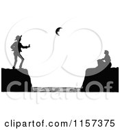 Clipart Of A Silhouetted Couple Divided On Coastal Cliffs Royalty Free Vector Illustration