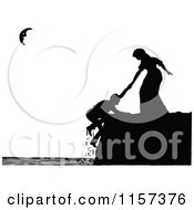 Clipart Of A Silhouetted Woman Helping A Man On A Coastal Cliff Royalty Free Vector Illustration