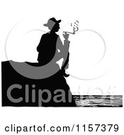 Clipart Of A Silhouetted Couple Man Smoking On A Coastal Cliff Royalty Free Vector Illustration