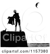 Clipart Of A Silhouetted Couple Man On A Coastal Cliff Royalty Free Vector Illustration