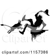 Clipart Of A Silhouetted Dog And Man Royalty Free Vector Illustration