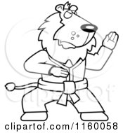 Cartoon Clipart Of A Black And White Karate Lion Vector Outlined Coloring Page