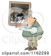 Caucasian Man Hanging Up A Snowy Mountain Picture