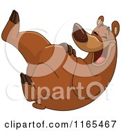 Cartoon Of A Bear Rolling Around And Laughing Royalty Free Vector Clipart