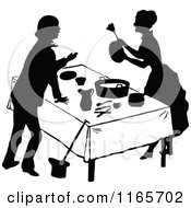Clipart Of A Silhouetted Couple Talking At A Table Royalty Free Vector Illustration