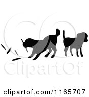 Clipart Of Silhouetted Dogs Playing With Sticks Royalty Free Vector Illustration