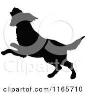 Clipart Of A Silhouetted Dog Jumping Royalty Free Vector Illustration