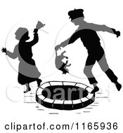 Clipart Of A Silhouetted Girl Ringing A Bell On A Mean Boy Holding A Cat Over A Well Royalty Free Vector Illustration