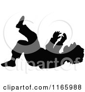 Poster, Art Print Of Silhouetted Boy Laughing On The Ground