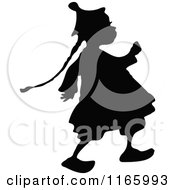 Clipart Of A Silhouetted Walking Child Royalty Free Vector Illustration