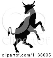 Clipart Of A Silhouetted Rearing Cow Royalty Free Vector Illustration