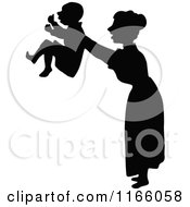 Clipart Of A Silhouetted Mother Holding Up Her Son Royalty Free Vector Illustration