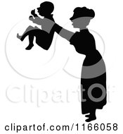 Poster, Art Print Of Silhouetted Mother Holding Up Her Son