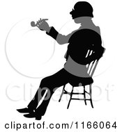 Poster, Art Print Of Silhouetted Man Smoking A Pipe And Sitting