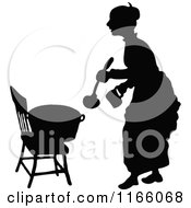 Poster, Art Print Of Silhouetted Woman With A Pot Of Food