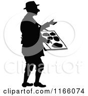Clipart Of A Silhouetted Vendor Man Royalty Free Vector Illustration