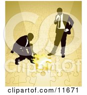 Two Businessmen Completing A Yellow Jigsaw Puzzle Together Clipart Illustration