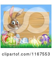 Poster, Art Print Of Brown Easter Bunny With Eggs In Grass And A Basket By A Wood Sign With Blue Sky