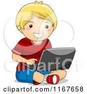 Happy Blond Boy Using A Laptop On The Floor