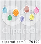 Clipart Of Suspended Easter Eggs Over White Fence Panels Royalty Free Vector Illustration