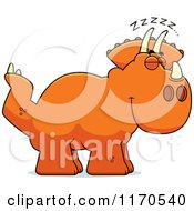 Cartoon Of A Sleeping Triceratops Dinosaur Royalty Free Vector Clipart