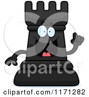 Cartoon Of A Smart Black Chess Rook Mascot With An Idea Royalty Free Vector Clipart