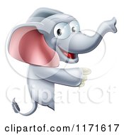 Cartoon Of A Happy Elephant Pointing To A Sign Royalty Free Vector Clipart