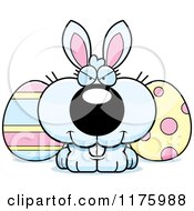 Cartoon Of A Sly Easter Bunny With Eggs Royalty Free Vector Clipart