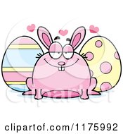Cartoon Of A Loving Chubby Easter Bunny With Eggs Royalty Free Vector Clipart