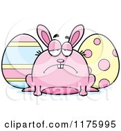 Cartoon Of A Depressed Chubby Easter Bunny With Eggs Royalty Free Vector Clipart