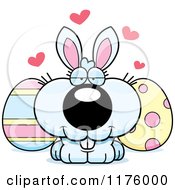 Cartoon Of A Loving Easter Bunny With Eggs Royalty Free Vector Clipart