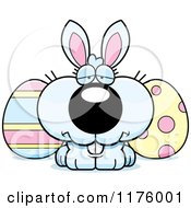 Cartoon Of A Depressed Easter Bunny With Eggs Royalty Free Vector Clipart