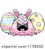 Cartoon Of A Sly Chubby Easter Bunny With Eggs Royalty Free Vector Clipart