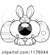 Cartoon Of A Black And White Mad Easter Bunny With Eggs Royalty Free Vector Clipart