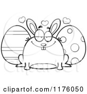 Cartoon Of A Black And White Loving Chubby Easter Bunny With Eggs Royalty Free Vector Clipart
