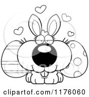 Cartoon Of A Black And White Loving Easter Bunny With Eggs Royalty Free Vector Clipart