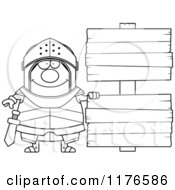 Cartoon Of A Black And White Happy Armoured Knight By Wooden Signs Royalty Free Vector Clipart