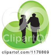 Silhouetted Caring Nurse Walking With A Man And A Cane Over A Green Heart