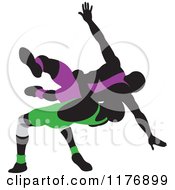 Clipart Of Silhouetted Wrestlers In Purple And Green Uniforms Royalty Free Vector Illustration