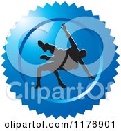 Clipart Of A Blue Wrestling Logo With Silhouetted Wrestlers Royalty Free Vector Illustration