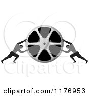Poster, Art Print Of Two Men Pushing Inward On A Silver Film Reel