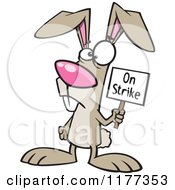 Cartoon Of The Easter Bunny Holding An On Strike Sign Royalty Free Vector Clipart