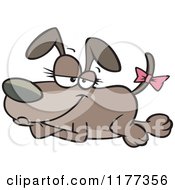 Cartoon Of A Relaxed Modling Dog With A Bow On Her Tail Royalty Free Vector Clipart