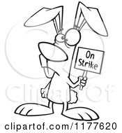 Cartoon Of An Outlined Easter Bunny Holding An On Strike Sign Royalty Free Vector Clipart