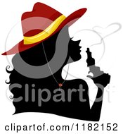 Poster, Art Print Of Silhouetted Cowgirl Wearing A Red Hat And Blowing Heart Smoke From A Gun