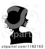 Cartoon Of A Black Silhouetted Woman With Gray Snowflakes Royalty Free Vector Clipart