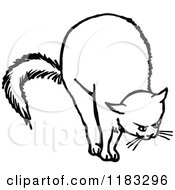 Clipart Of A Black And White Cat Stretching Royalty Free Vector Illustration